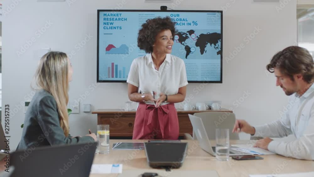 business people meeting in boardroom mixed race team leader woman presenting financial strategy with graph data on tv screen briefing colleagues discussing ideas in office presentation