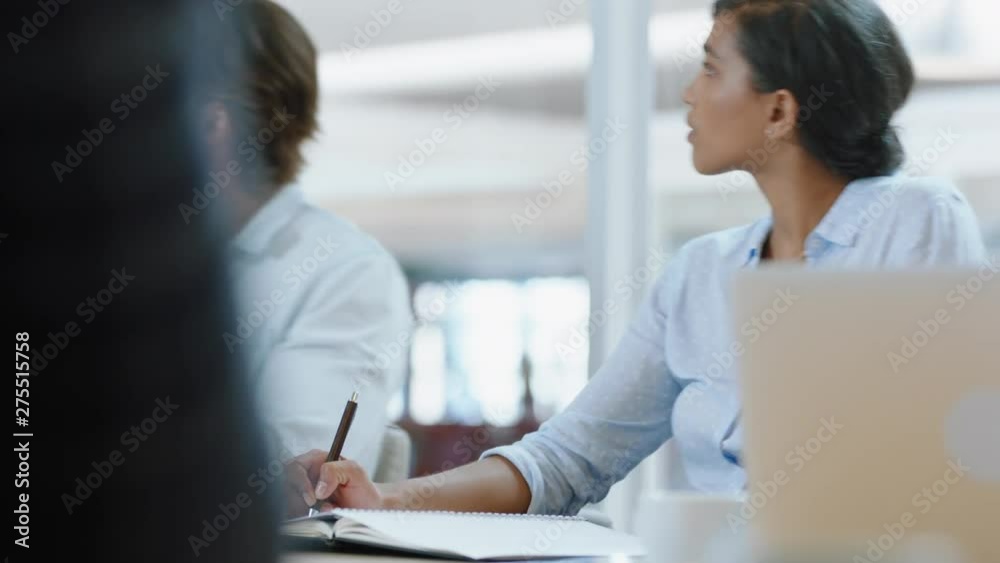 beautiful hispanic business woman writing notes in boardroom meeting with colleagues sharing ideas for corporate development strategy in office 4k beautiful hispanic business woman writing notes in boardroom meeting with colleagues sharing ideas for corporate development strategy in office 4k