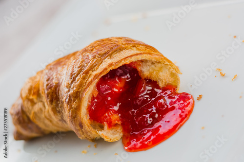 Fotografie Beautiful croissant with jam on plate