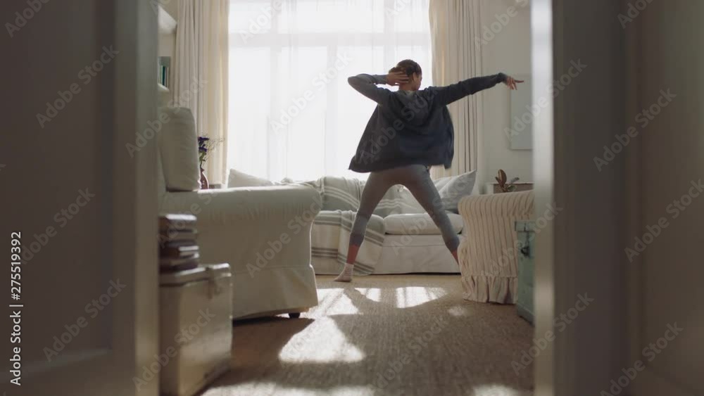 happy young woman dancing at home having fun celebrating with funny dance moves enjoying freedom on weekend morning 4k footage