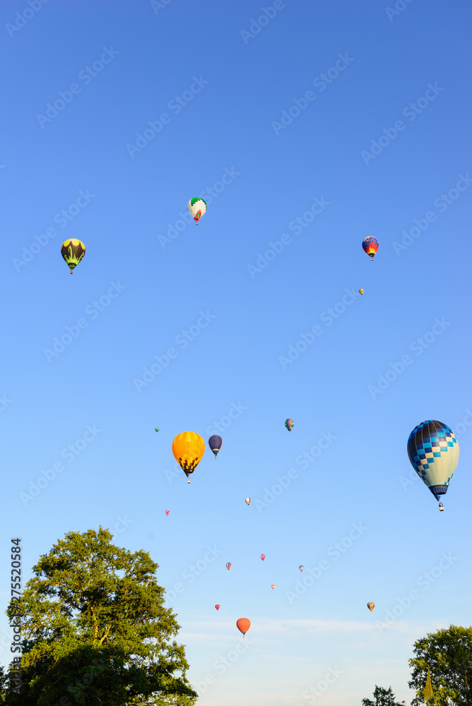 Balloons on the background blue sky.