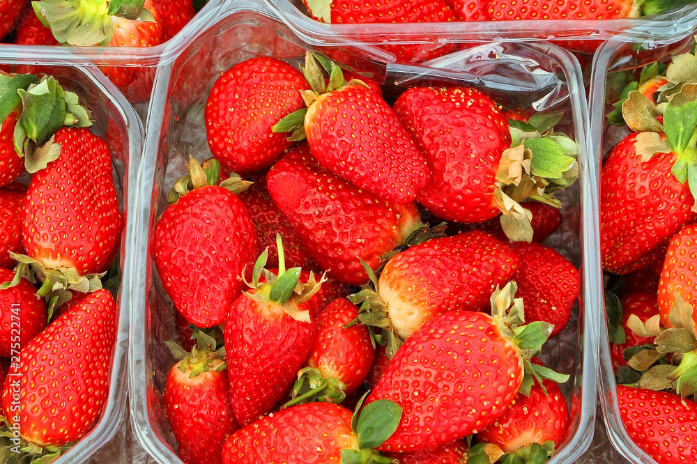 Fresh ripe strawberry in plastic boxes exposed for sale Fresh ripe strawberry in plastic boxes exposed for sale