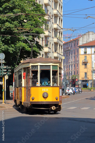 tram giallo a milano in italia, yellow streetcar in the downtown of milan city in italy	