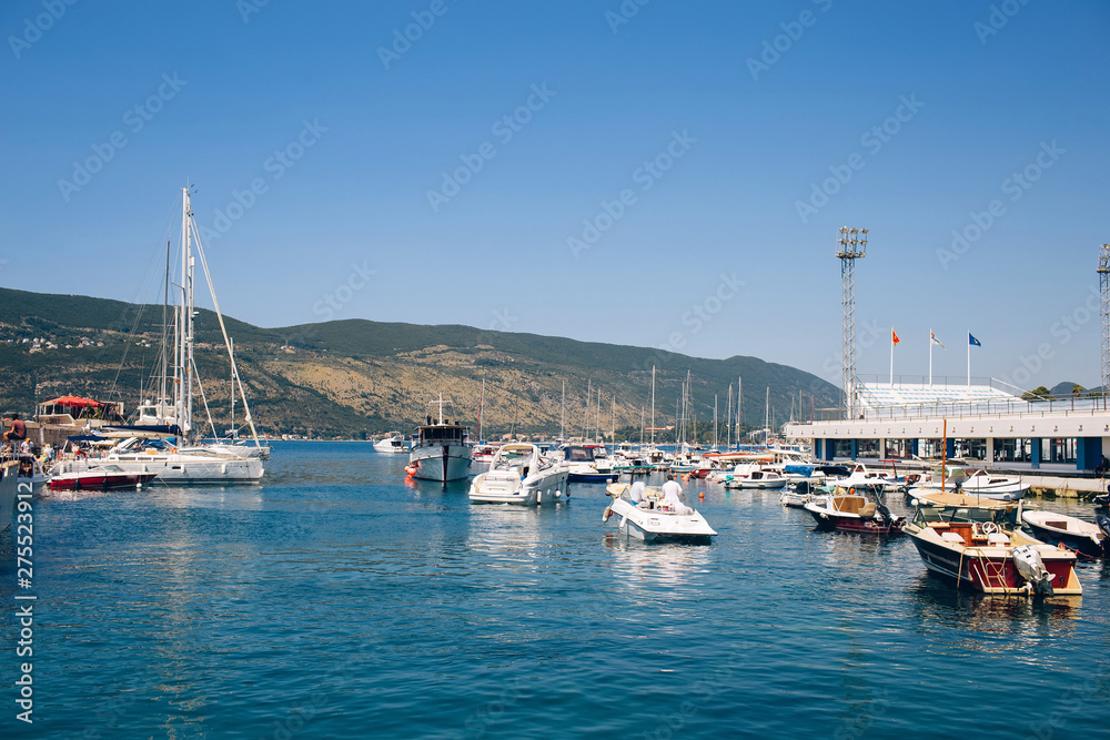 Seascape of the Adriatic Sea. The sea with mountains and mountains in the background. Boat sailing on the sea. Italy, Montenegro, Adriatic tourism