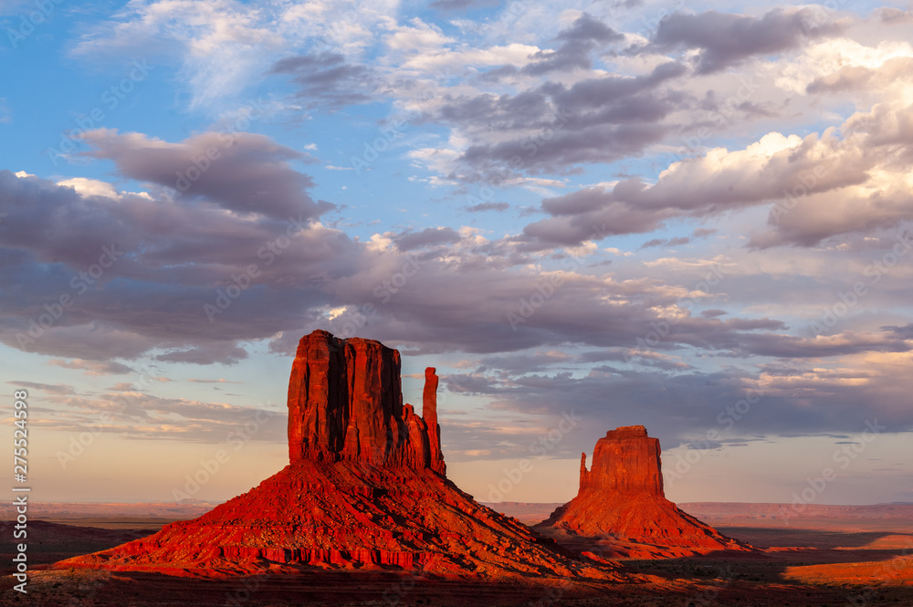 The famous Merrick and Mittens Buttes from monument valley basking in the Light of the setting sun.