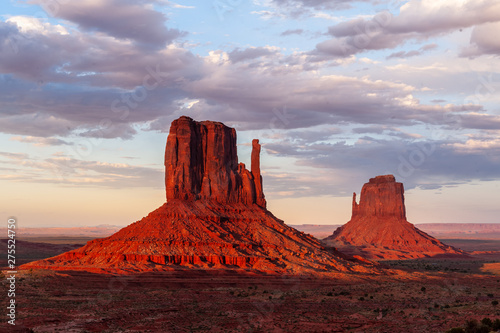 The famous Merrick and Mittens Buttes from monument valley basking in the Light of the setting sun. photo