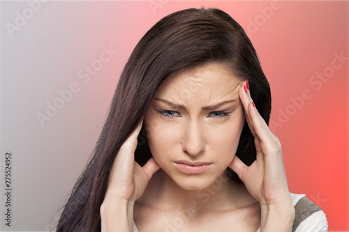 Woman having headache on background