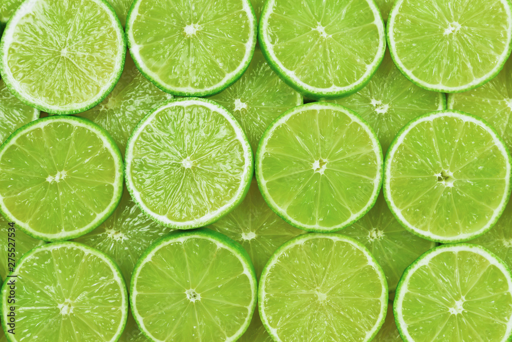 Fresh lime slices as a background.