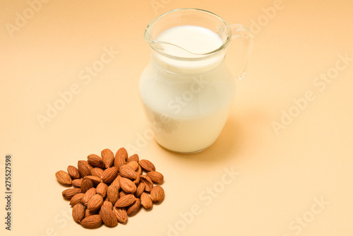 A jar with almond milk, nuts. Space for text or design.