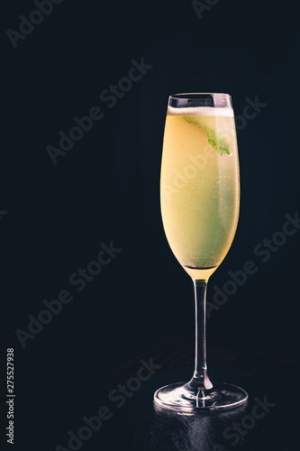 Drink with lime and mint in a champagne glass
