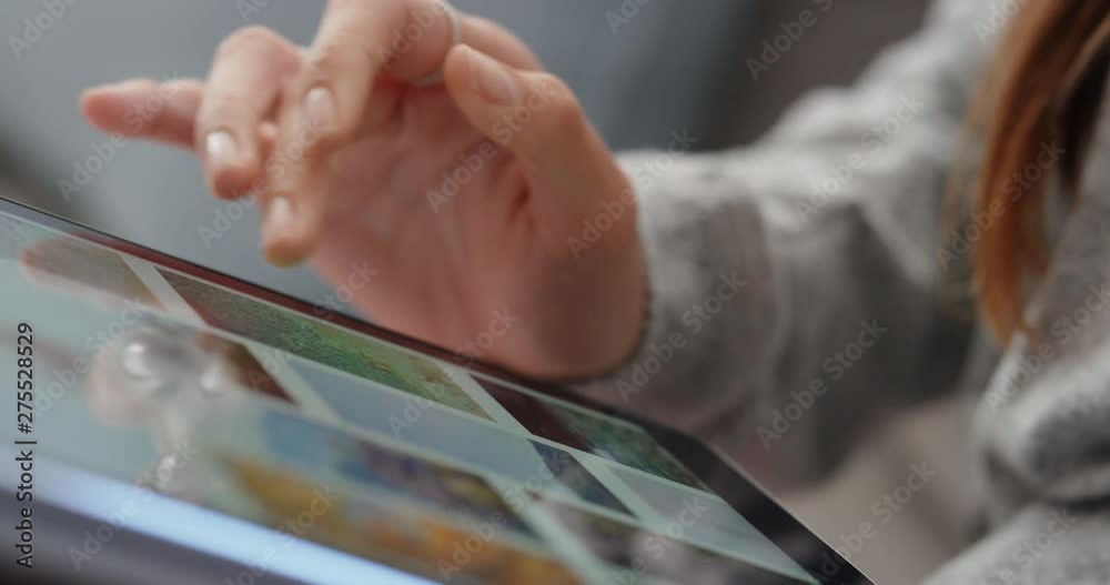 close up hand woman using tablet computer browsing online scrolling looking at social media pictures with mobile touchscreen technology unrecognizable person 4k