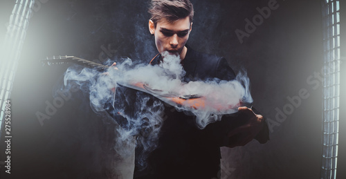 Cheeky young man is smoking...