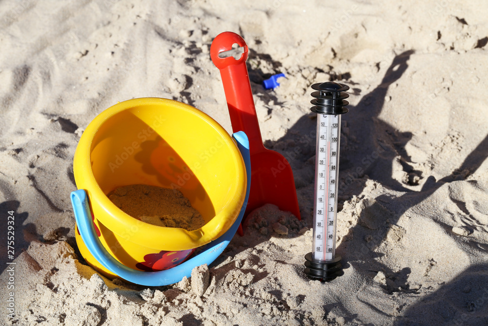 Thermometer in the sand on the beach Thermometer in the sand on the beach