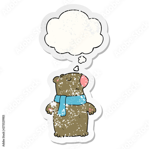 cartoon bear and thought bubble as a distressed worn sticker