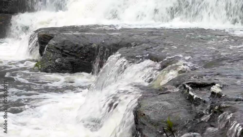 Slow Motion/Lockdown: Small Waterfall Splashing Over Large, Dark Rocks, Wollongong, Australia Slow Motion/Lockdown: Small Waterfall Splashing Over Large, Dark Rocks, Wollongong, Australia