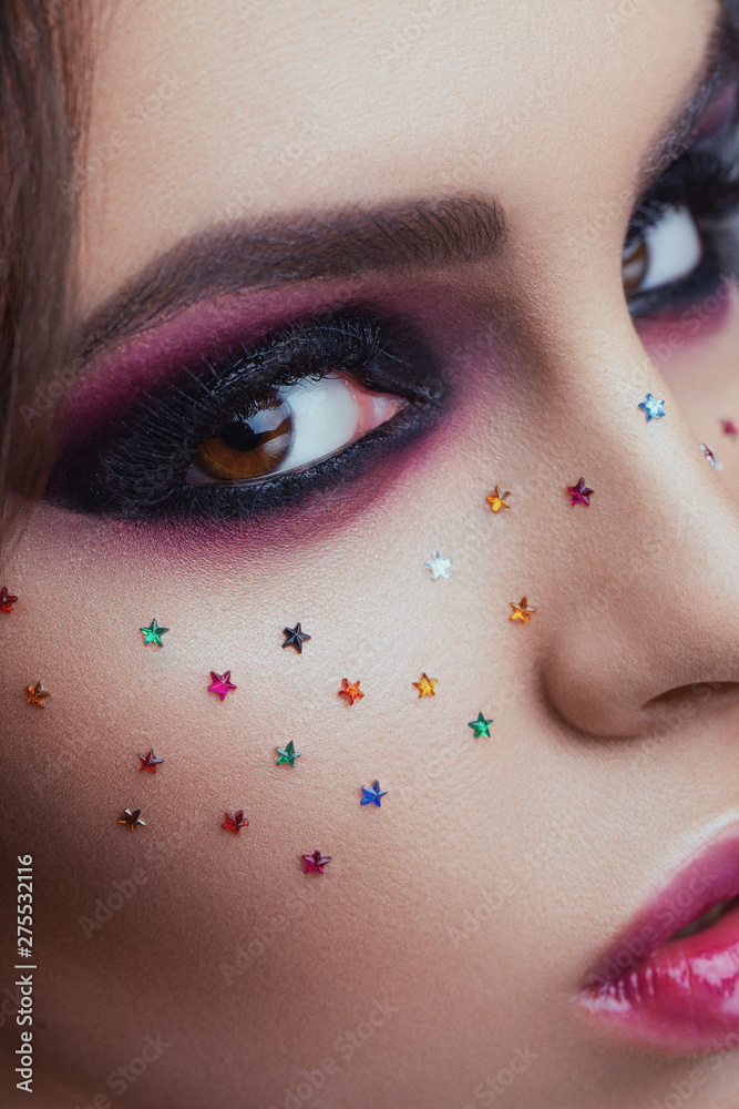 Fototapeta premium Close-up image of great beauty art make-up. Beauty. Beautiful Woman Face With soft color Lipstick. Sexy Full Lips. Portrait Of Female Model With Creative Makeup. Cosmetics and Skincare concept