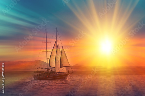 Old ancient ship on peaceful ocean at sunset. Calm waves reflection, sun setting. Copy space © Shcherbyna
