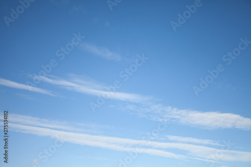 Beautiful view of hight blue sky with clouds. Happiness and freedom. Concept of climate, weather, environment. Background for design. Copy space.