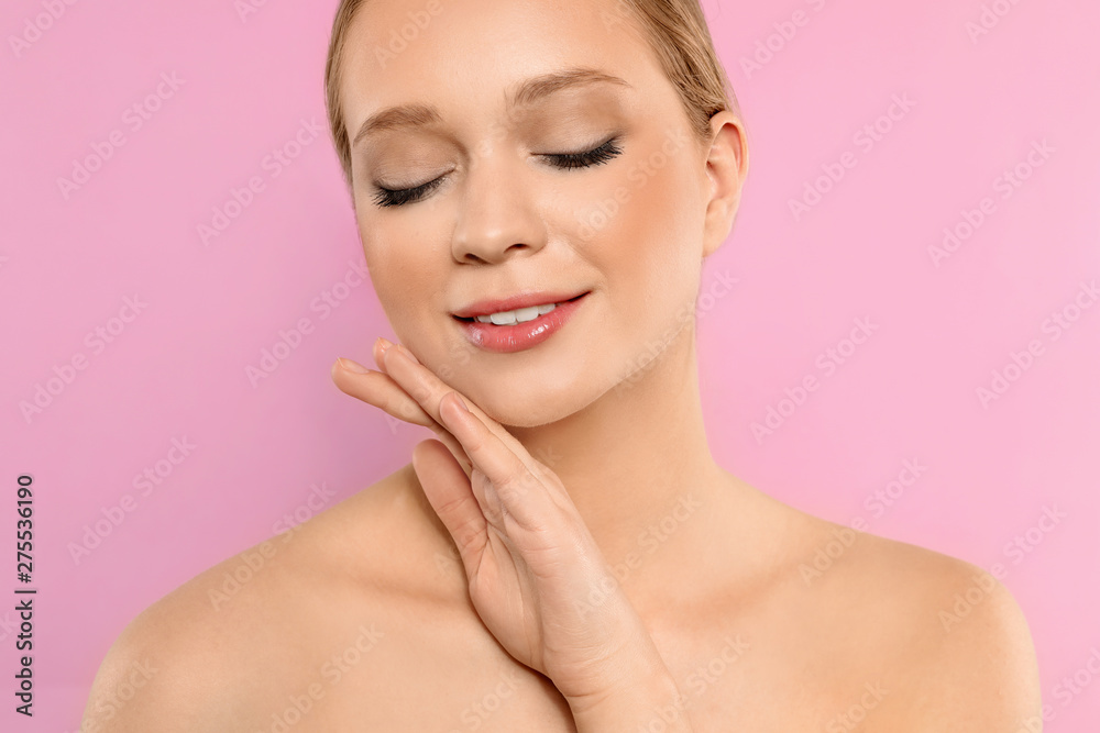 Portrait of young woman with beautiful face on pink background, closeup Portrait of young woman with beautiful face on pink background, closeup