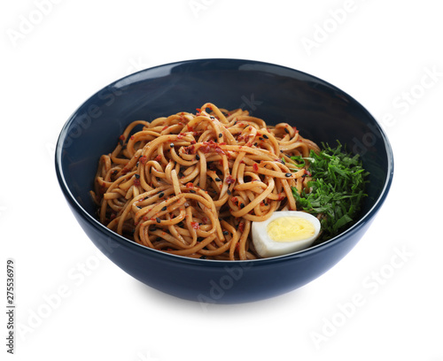 Bowl of noodles with spices and egg isolated on white