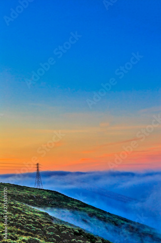 Tower in Fog at Sunrise on Hill
