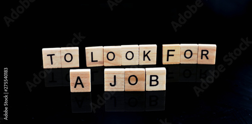 Business strategy and marketing concept, wooden cube figure with word TO LOOK FOR A JOB 