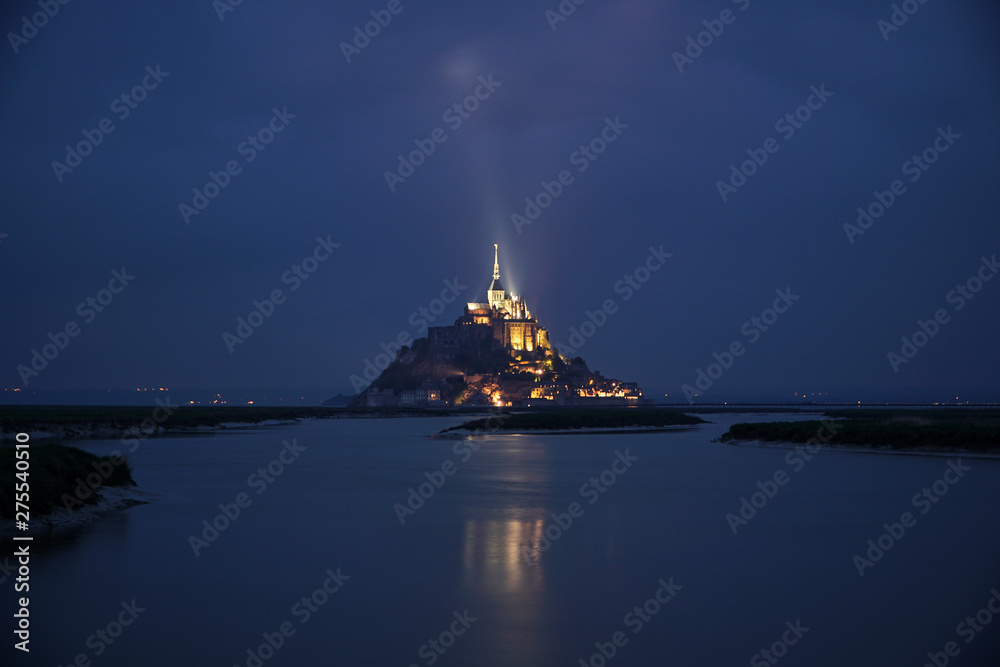 Fototapeta premium Dusk at Mont St Michel with illuminated cloud