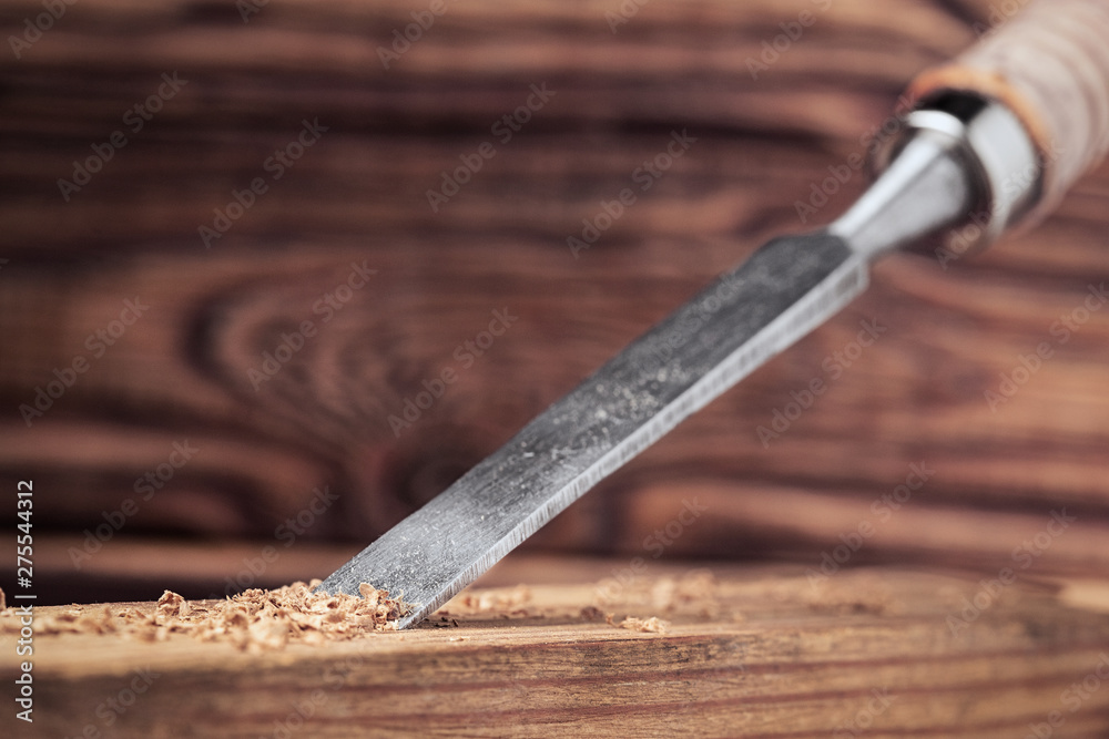 chisel cut groove in wooden pine plank. joinery, wood carving , carpenter's skill.