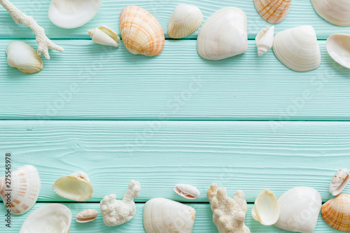 shells frame and seaside background for blog or desktop on mint green wooden table top view mockup