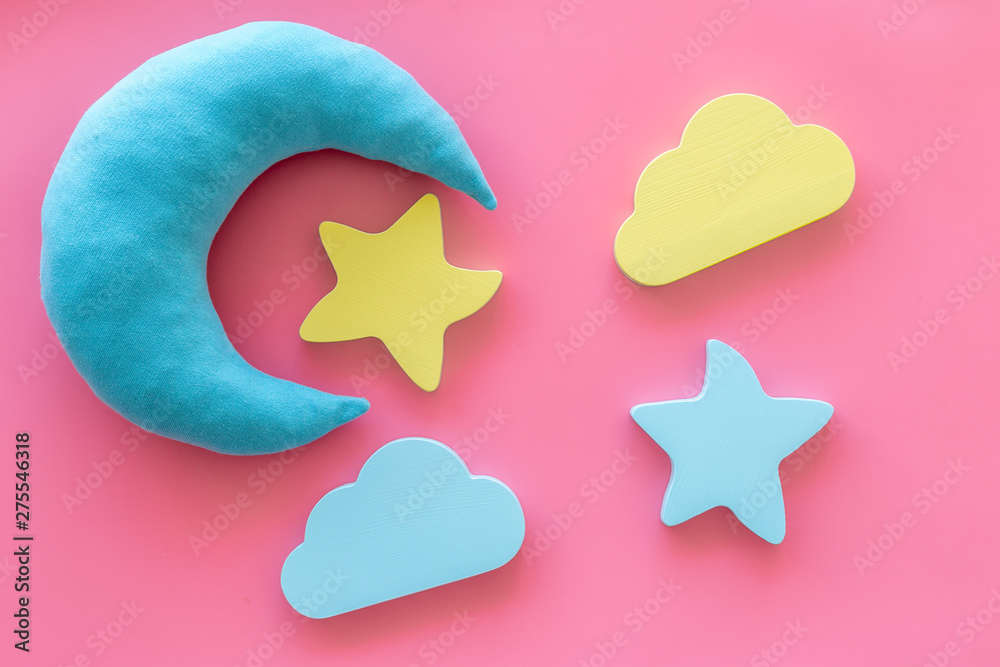 Sleep time concept with moon, stars, clouds on pink background top view Sleep time concept with moon, stars, clouds on pink background top view