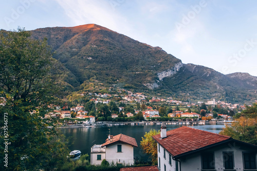 Beautiful view of Lake Como on sunset, Lombardy, Italy. View of beautiful italian Villa on Como lake in sunlight. Picturesque sunset at Lake Como