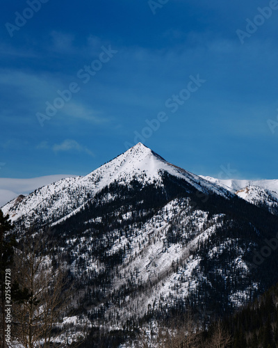 Beautiful mountain peak covered in snow during the winter in Colorado