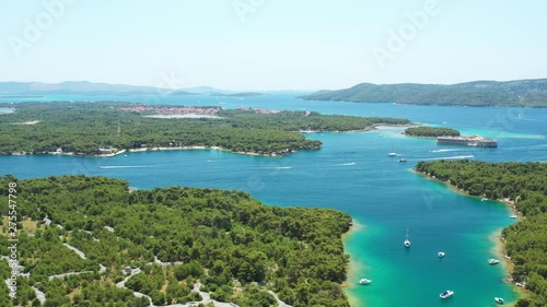 Croatian Adriatic coast, beautiful landscape in Sibenik channel, turquoise bays and small islands with yachts and boats, aerial view, old fort St Nicolas in background