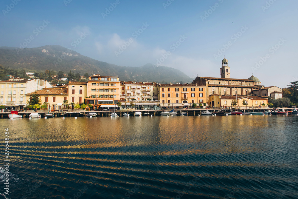 Obraz premium Beautiful panorama of Lake Garda Italy. View of the beautiful Lake Garda from a boat surrounded by mountains