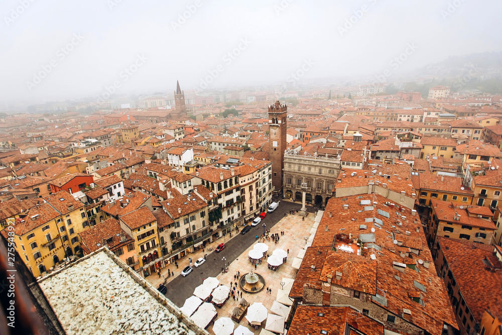 View on the old town Verona in aerial view, Italy. Fog above in Verona. red roofs of a medieval city in Italy