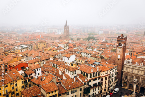 View on the old town Verona in aerial view, Italy. Fog above in Verona. red roofs of a medieval city in Italy