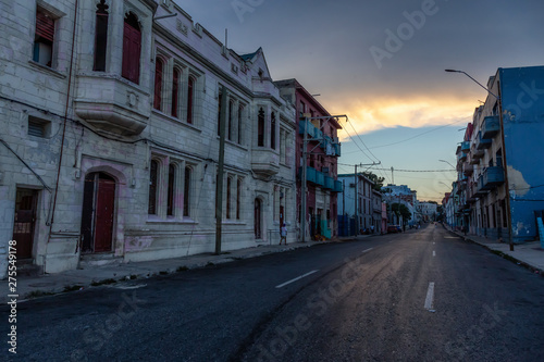 Street View of the Old Havana City, Capital of Cuba, during a cloudy and sunny sunset. © edb3_16
