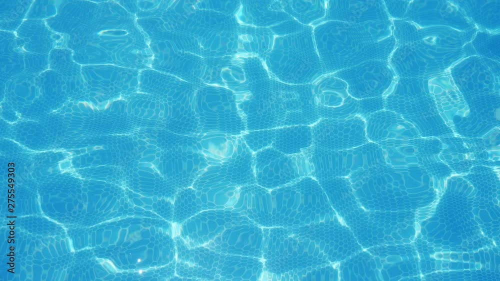 Turquoise water playing cheerily in a swimming pool on a sunny day in slo-mo Turquoise water playing cheerily in a swimming pool on a sunny day in slo-mo