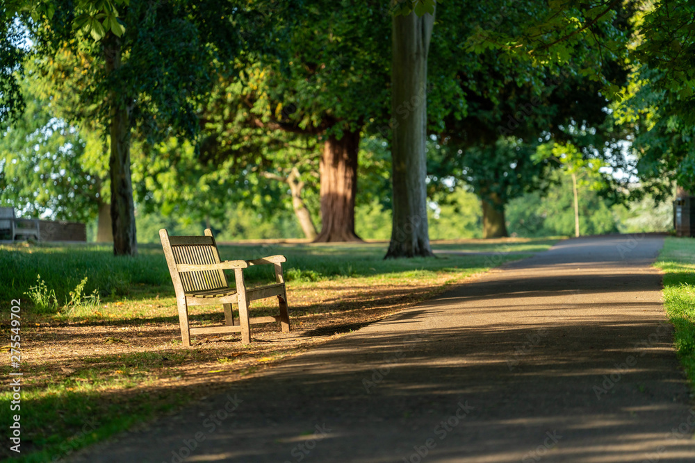 An empty bench in Marble Hill park in Twickenham, West London