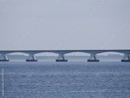 Part from  a long bridge in the rivers Rhine, Maas delta in the Netherlands, called Zeelandbrug, near the small town Colijnsplaat on the island Beveland at the estuary Oosterschelde photo