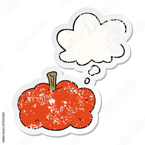 cartoon pumpkin and thought bubble as a distressed worn sticker