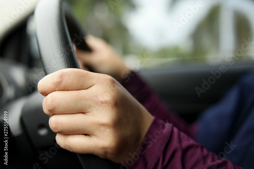 Close up of Hands Driving Car Concept