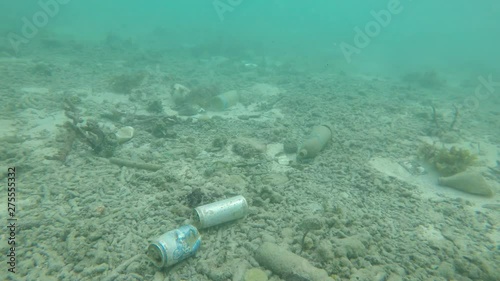 Pollution in ocean. Drinks cans, plastic bottles and bags dumped in sea accumulate on ocean floor. 
