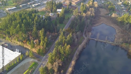 All encompassing aerial shot of Tacoma's Lake Wapato with nearby freeways on the horizon. photo