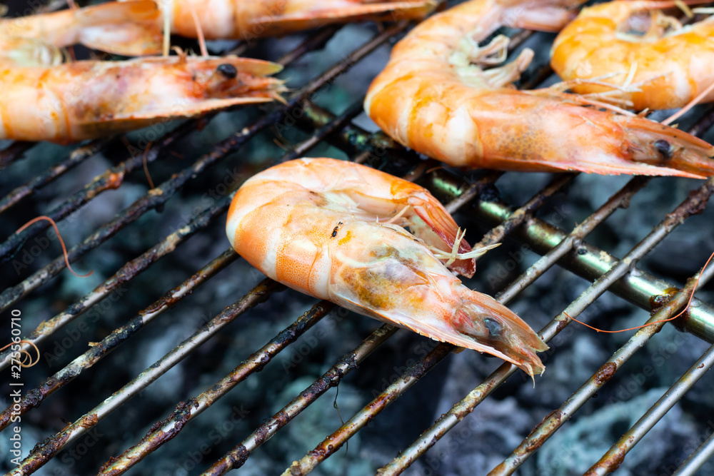 Shrimp has been cooked on barbeque grill background