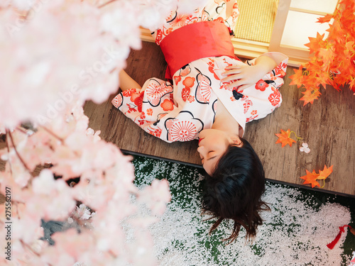 Photography Portrait of attractive Chinese woman wearing traditional Japanese Kimono, lying on the tatami mats with eyes closed, a little bit drunk, high angle view, oriental beauty