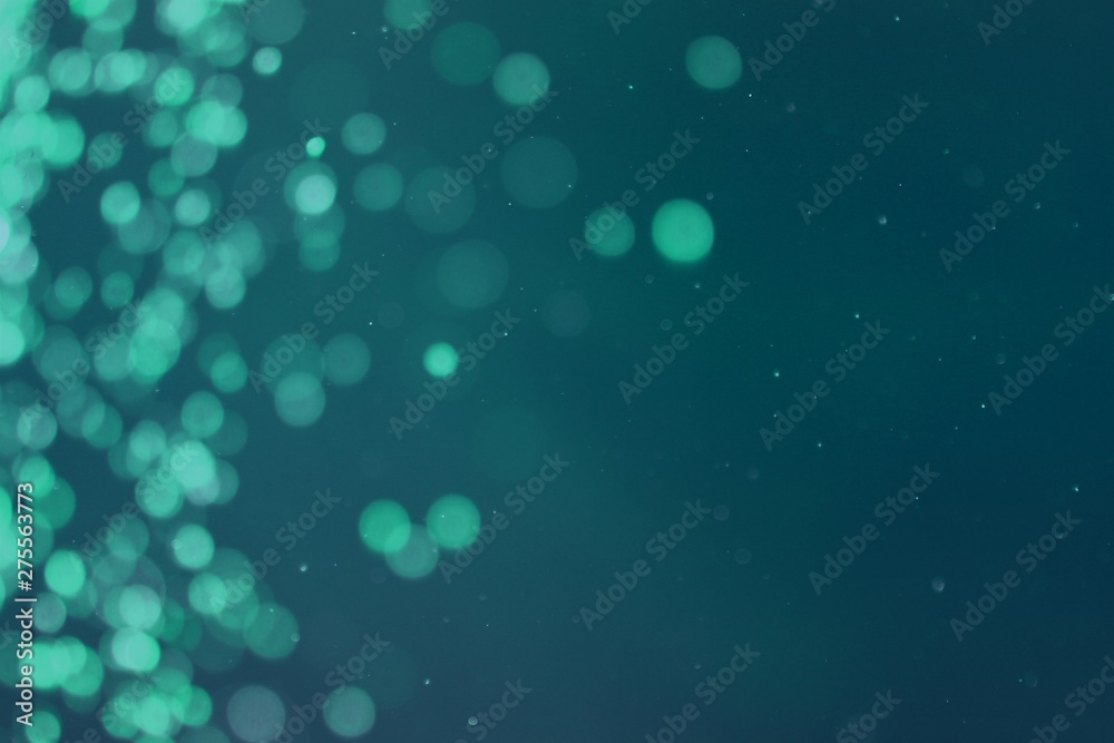 teal, sea-green glossy lights one side frame bokeh texture - wonderful abstract photo background