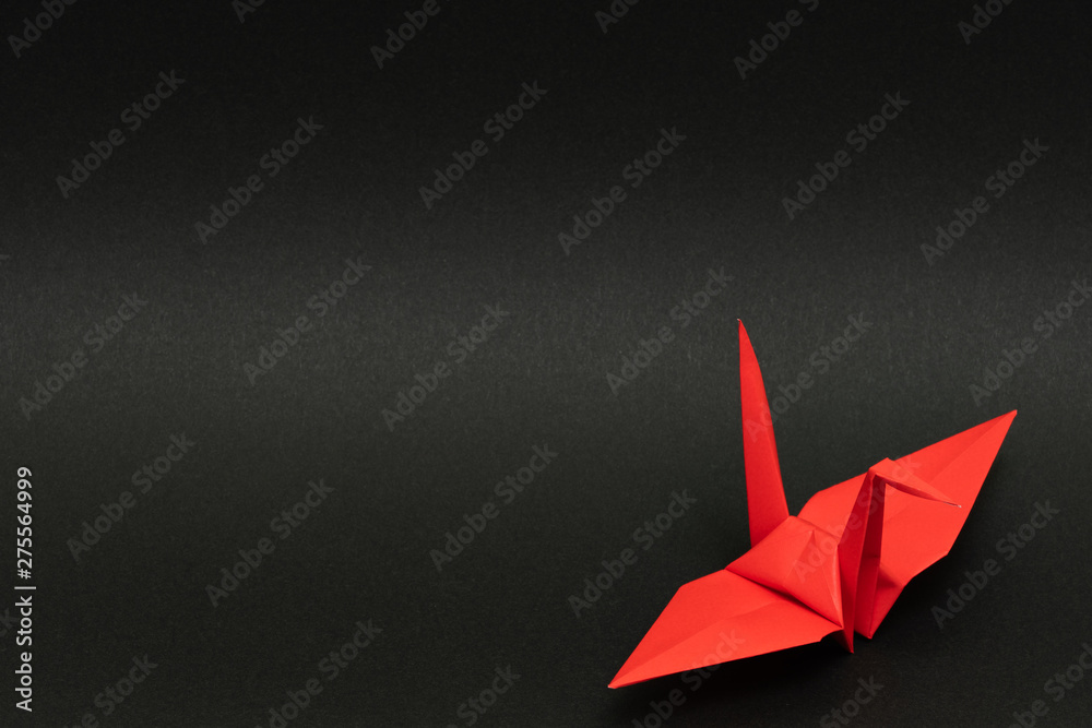 Red Origami Paper Crane On Red Background Closeup High-Res Stock