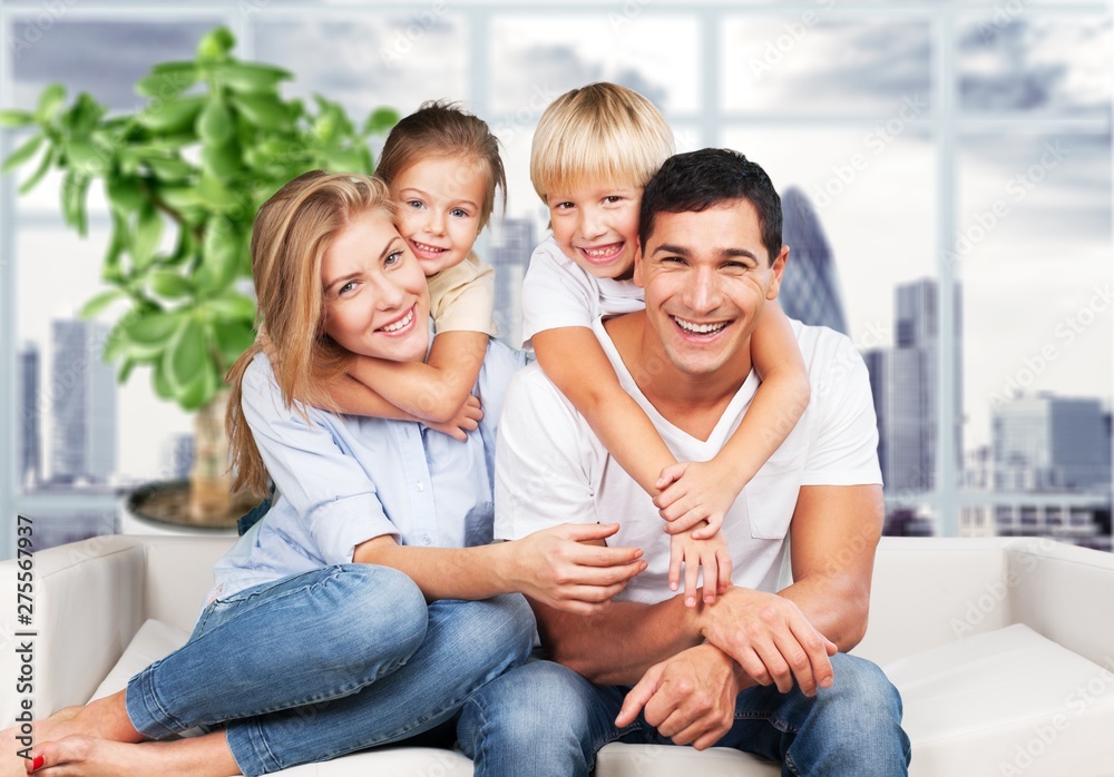 Young family at home smiling at camera Young family at home smiling at camera