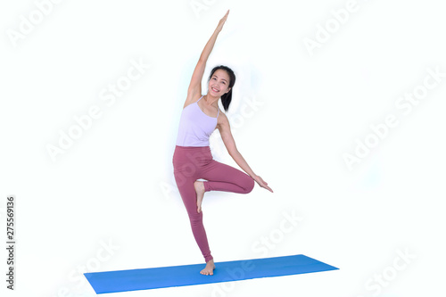Beautiful Asia girl practicing yoga on isolated white background : Concept practicing © Morakot